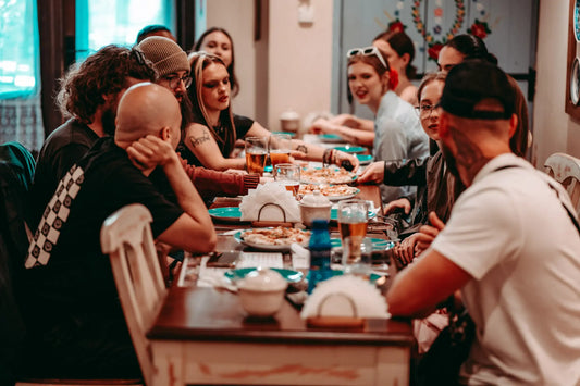 Krakow Tasty Food Tour group sitting together at a table chatting and having fun.